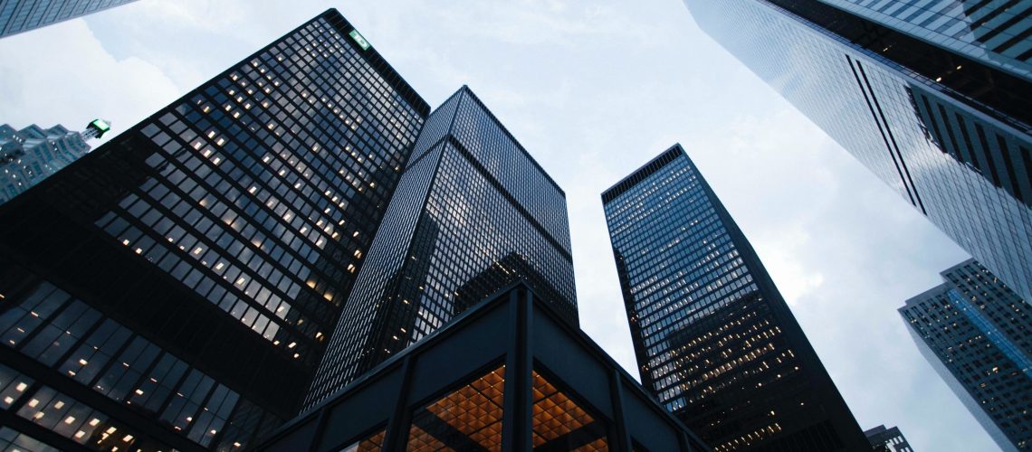 low angle photo of city high rise buildings during daytime